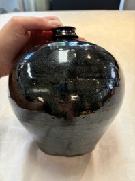 A Chinese Jizhou tortoiseshell-glazed tea bowl, a ewer and a black-glazed vase, Jin and later