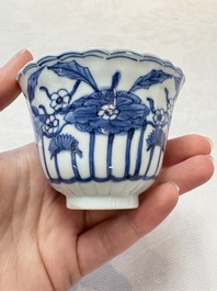 A set of six Chinese blue and white cups and saucers with floral design, Kangxi mark, 19th C.