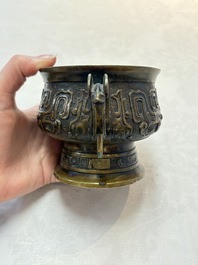 A Chinese archaistic bronze censer with a wooden cover, Xuande mark, 19th C.