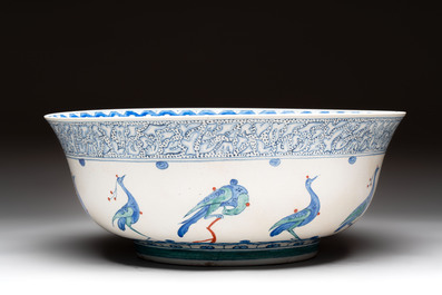 A large polychrome Iznik-style 'peacocks' bowl on a wooden stand, Samson, Paris, 19th C.