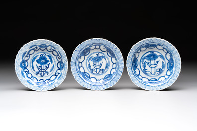 A set of six Chinese blue and white cups and saucers with floral design, Kangxi mark, 19th C.