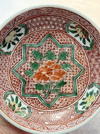 A Chinese wucai plate with floral design, Kangxi