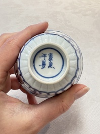 A set of six Chinese blue and white cups and saucers with floral design, Kangxi mark, 19th C.