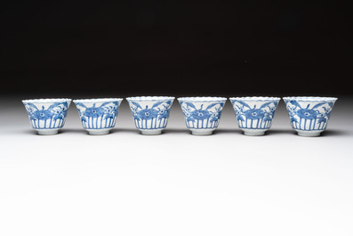 A set of six Chinese blue and white cups and saucers with floral design, Kangxi mark, 19th C.