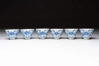 A set of six Chinese blue and white cups and saucers with floral design, Kangxi mark, 19th C.