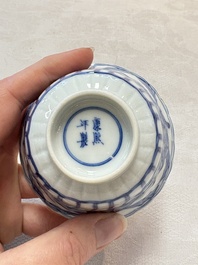 A set of six Chinese blue and white cups and saucers with floral design, Kangxi mark, 19th C.