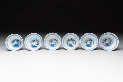 A set of six Chinese blue and white cups and saucers with floral design, Kangxi mark, 19th C.