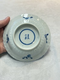 A set of six Chinese blue and white cups and saucers with floral design, Kangxi mark, 19th C.