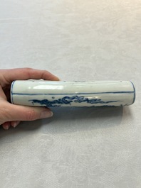 A Chinese blue and white wrist rest with figural design, 19th C.