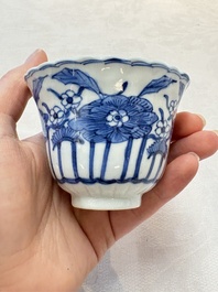 A set of six Chinese blue and white cups and saucers with floral design, Kangxi mark, 19th C.