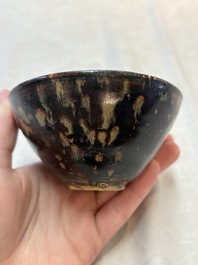 A Chinese Jizhou tortoiseshell-glazed tea bowl, a ewer and a black-glazed vase, Jin and later