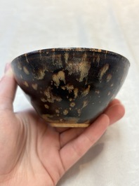 A Chinese Jizhou tortoiseshell-glazed tea bowl, a ewer and a black-glazed vase, Jin and later