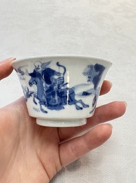 A Chinese blue and white 'Mongolian hunting' cup and saucer, jade mark, Kangxi