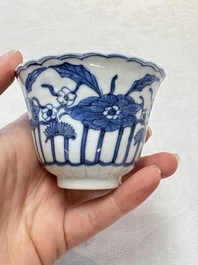 A set of six Chinese blue and white cups and saucers with floral design, Kangxi mark, 19th C.