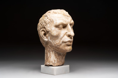 An Italian Grand Tour marble sculpture of a man's head in Roman style, probably after a bust of Caesar, 19th C.