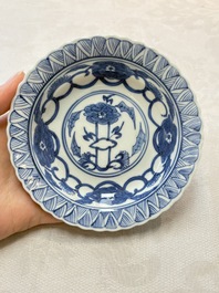 A set of six Chinese blue and white cups and saucers with floral design, Kangxi mark, 19th C.