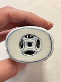 A Chinese blue and white wrist rest with figural design, 19th C.