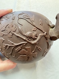 A Chinese Yixing stoneware 'squirrels among grapevines' teapot and cover, Kangxi