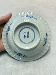 A set of six Chinese blue and white cups and saucers with floral design, Kangxi mark, 19th C.