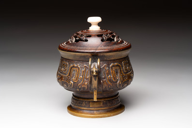 A Chinese archaistic bronze censer with a wooden cover, Xuande mark, 19th C.