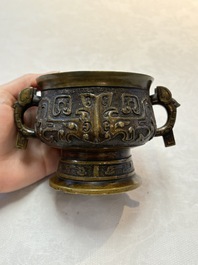A Chinese archaistic bronze censer with a wooden cover, Xuande mark, 19th C.