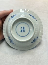 A set of six Chinese blue and white cups and saucers with floral design, Kangxi mark, 19th C.
