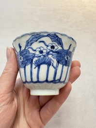 A set of six Chinese blue and white cups and saucers with floral design, Kangxi mark, 19th C.