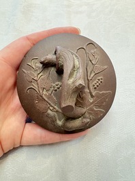 A Chinese Yixing stoneware 'squirrels among grapevines' teapot and cover, Kangxi