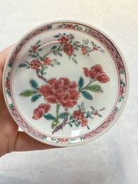 A set of six Chinese famille rose 'peonies' cups and saucers, Yongzheng/Qianlong