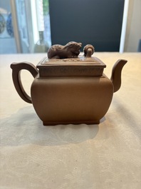A Chinese Yixing stoneware 'lion and brocade ball' teapot and cover, Qianlong