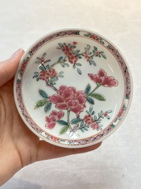 A set of six Chinese famille rose 'peonies' cups and saucers, Yongzheng/Qianlong