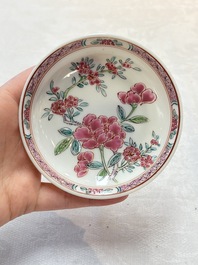 A set of six Chinese famille rose 'peonies' cups and saucers, Yongzheng/Qianlong
