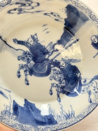 A Chinese blue and white 'Mongolian hunting' cup and saucer, jade mark, Kangxi