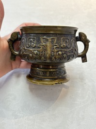 A Chinese archaistic bronze censer with a wooden cover, Xuande mark, 19th C.