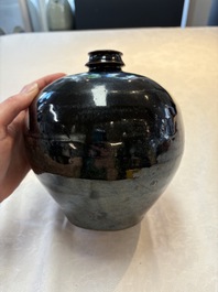 A Chinese Jizhou tortoiseshell-glazed tea bowl, a ewer and a black-glazed vase, Jin and later