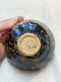 A Chinese Jizhou tortoiseshell-glazed tea bowl, a ewer and a black-glazed vase, Jin and later