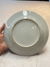 A pair of Chinese famille rose plates with a lady and boys in a boat, Yongzheng/Qianlong