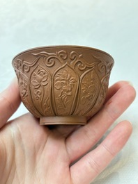 A set of five Chinese Yixing stoneware cups with floral design, Kangxi