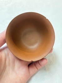 A set of five Chinese Yixing stoneware cups with floral design, Kangxi