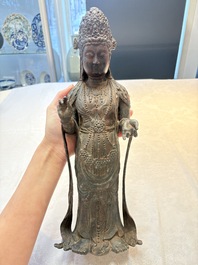 A fine and large Chinese bronze standing Buddha, possibly Liao