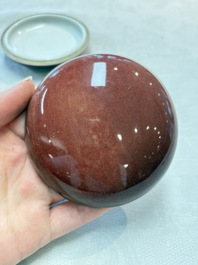 A Chinese robin's egg-glazed censer on a wooden stand and a copper-red-glazed seal paste box and cover, 19/20th C.