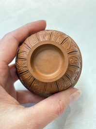 A set of five Chinese Yixing stoneware cups with floral design, Kangxi