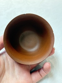 A set of five Chinese Yixing stoneware cups with floral design, Kangxi