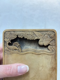 A Chinese ink stone with phoenix and carp design, Qianlong mark and possibly of the period