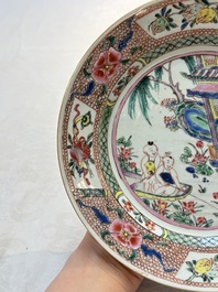 A pair of Chinese famille rose plates with a lady and boys in a boat, Yongzheng/Qianlong