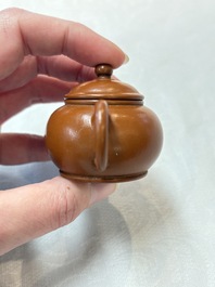 A small Chinese Yixing stoneware covered teapot and two Swatow Yixing-style covered teapots, Yixing Hui Mengchen 宜興惠孟臣製 and Shunji 順記 marks, 19/20th C