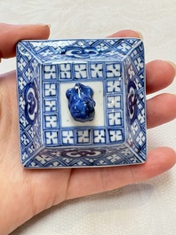 A pair of Chinese blue and white square flasks and covers with narrative design, Kangxi