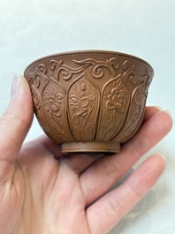A set of five Chinese Yixing stoneware cups with floral design, Kangxi