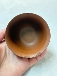 A set of five Chinese Yixing stoneware cups with floral design, Kangxi