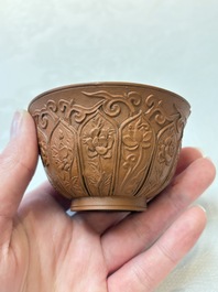 A set of five Chinese Yixing stoneware cups with floral design, Kangxi